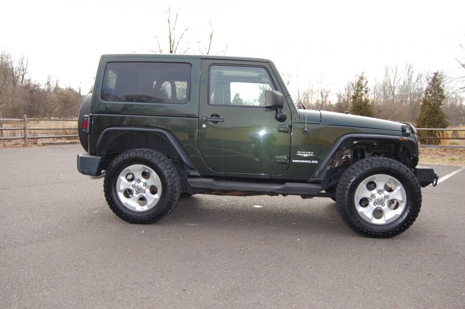 2011 Green /Tan leather Jeep Wrangler Sahara 4WD (1J4AA5D10BL) with an 3.8L V6 OHV 12V engine, 6 Speed Manual transmission, located at 6528 Lower York Road, New Hope, PA, 18938, (215) 862-9555, 40.358707, -74.977882 - Here we have a nice running and driving Jeep Wrangler with a 3.8L V6 putting power to a 4x4 manual transmission. Options include Tan leather, AC, heat, heated front seats, power windows/locks/mirrors, AM/FM/SAT/DISC/AUX radio, cruise control, tilt steering wheel, auto headlights, 3 piece removable h - Photo#3